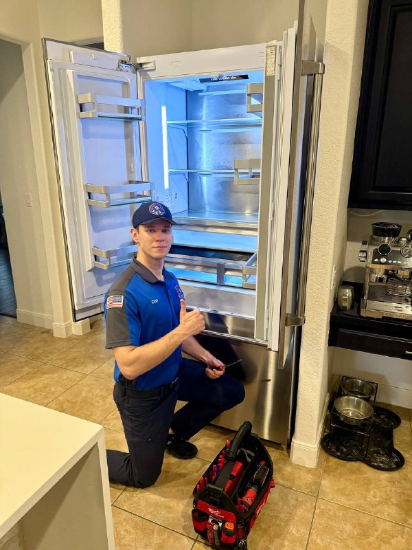 Quick Tweak technician completing a refrigerator repair in a San Antonio home